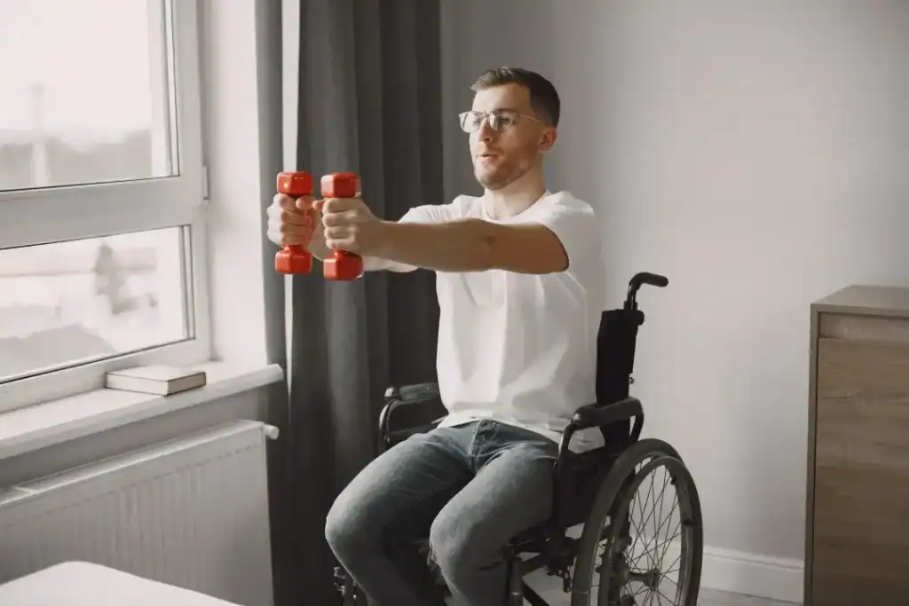 Image of man doing exercise in his wheelchair to aid weight loss Hastings