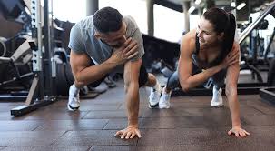 Sculpting Sleek Arms: The Essential Role of Cardio in Toning Without Bulking Up 1 Image of man and woman doing Cardio Hastings to tone their arms.